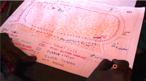 Village mapping with a teacher, Kampala, Uganda